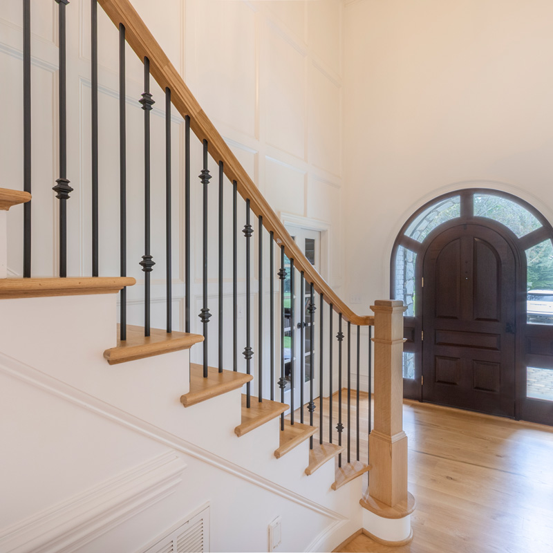 stairway with iron and wood railing
