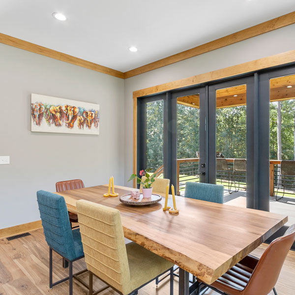 patio door and dining room with table and chairs
